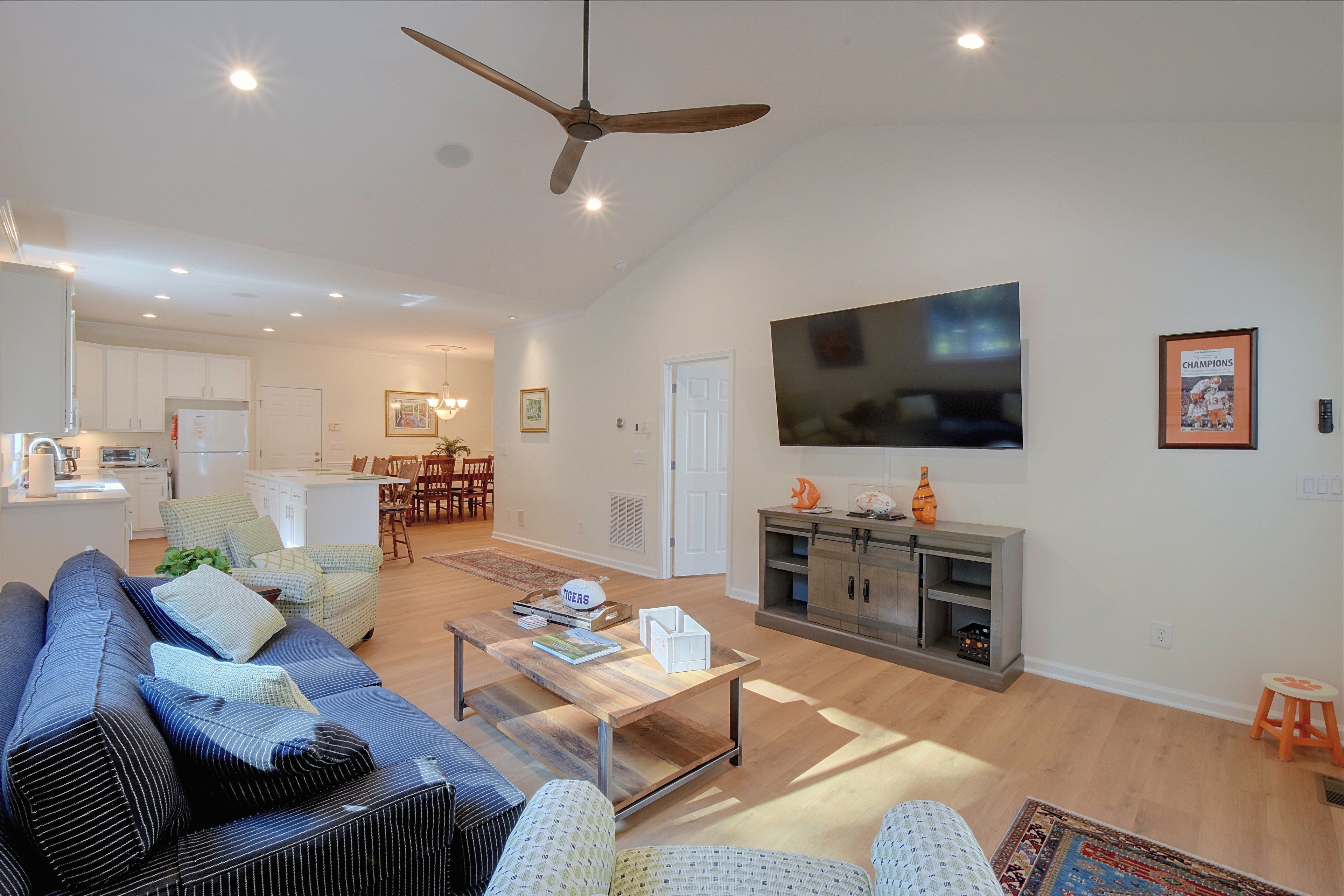 Living room perspective facing television and french doors.