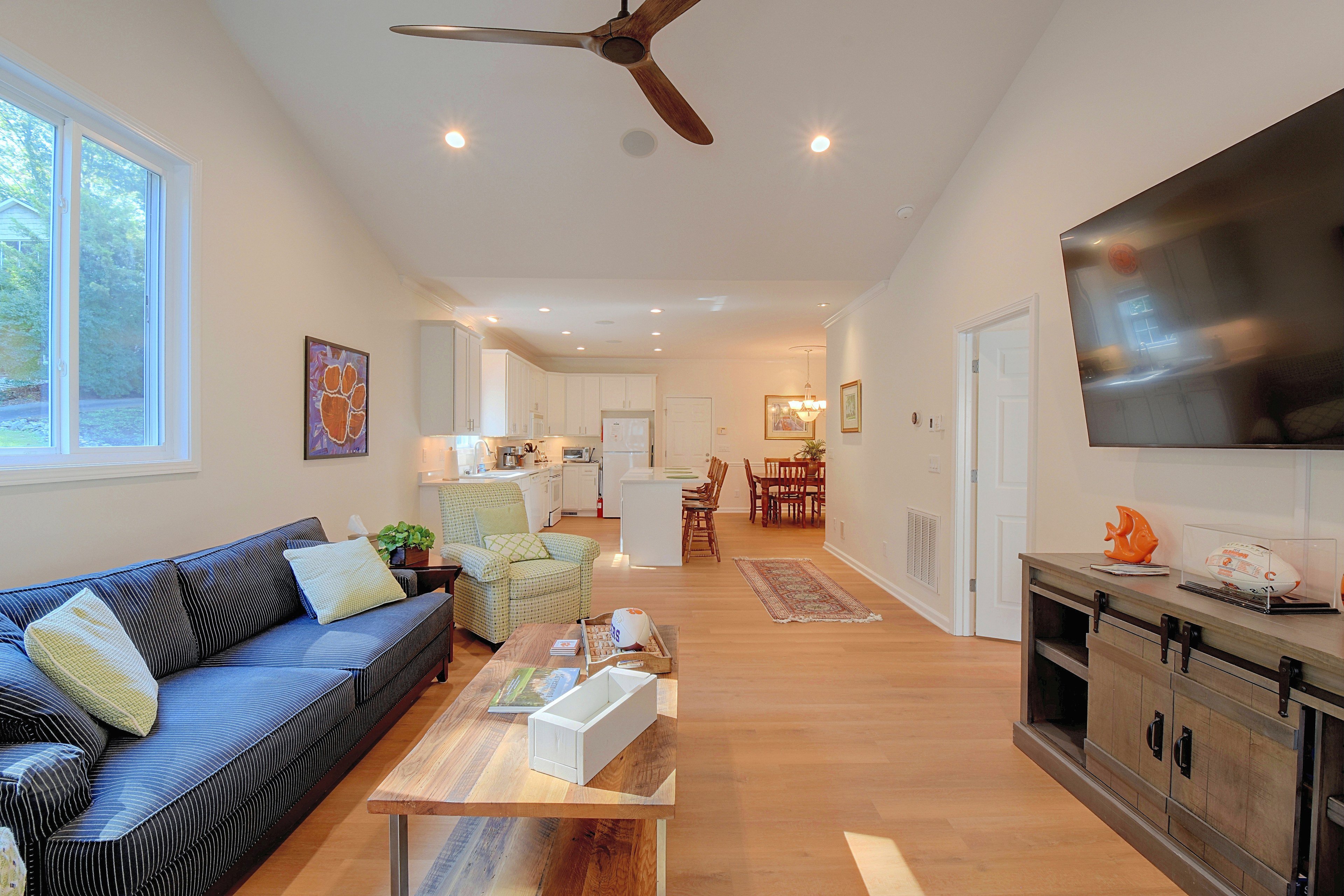 Living room corner view facing open kitchen layout.