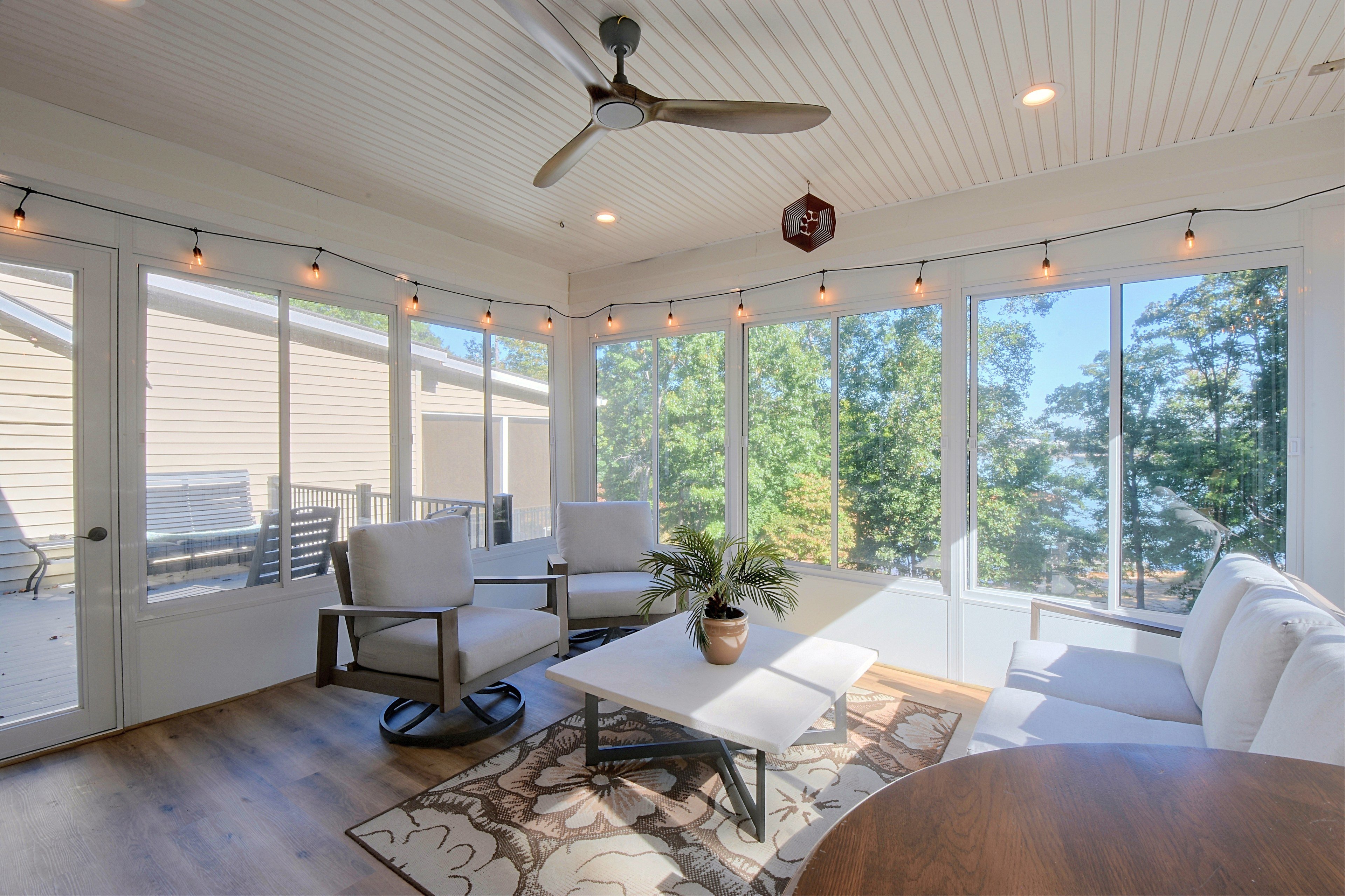 Sunroom seating group with coffee table and area rug.