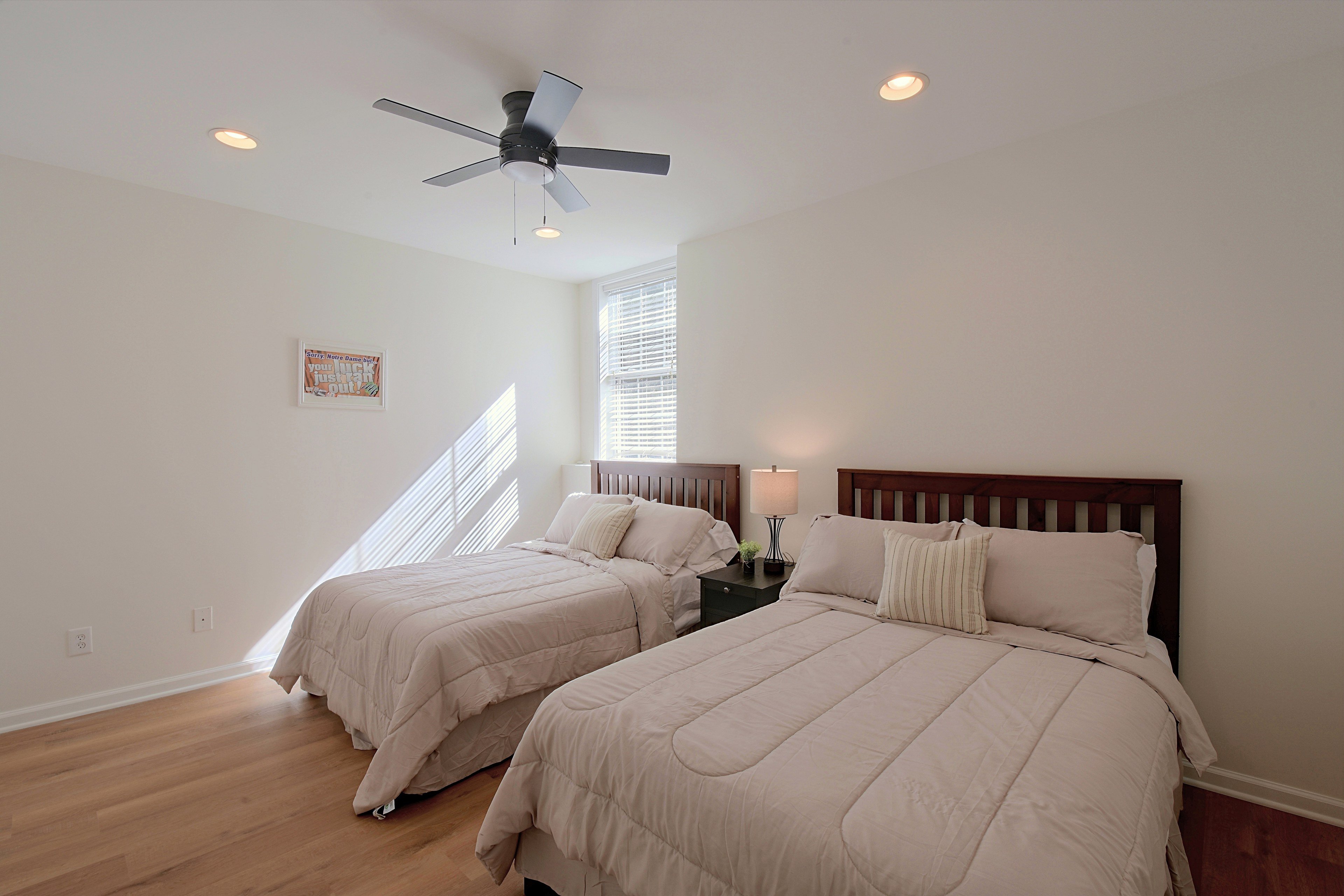 Third bedroom furnished with two beds, ideal for extra guests.