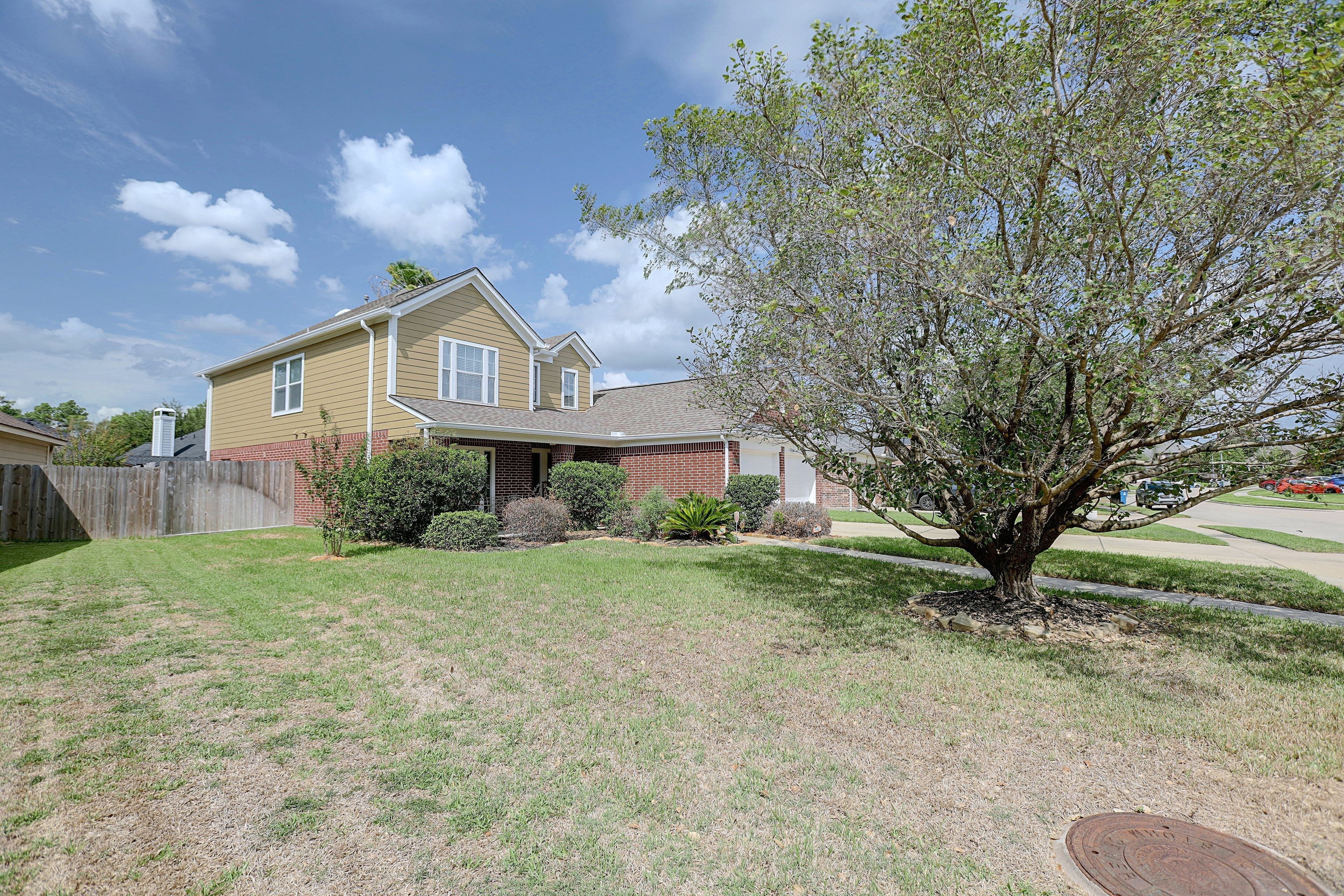 Front lawn and side exterior view of the home.