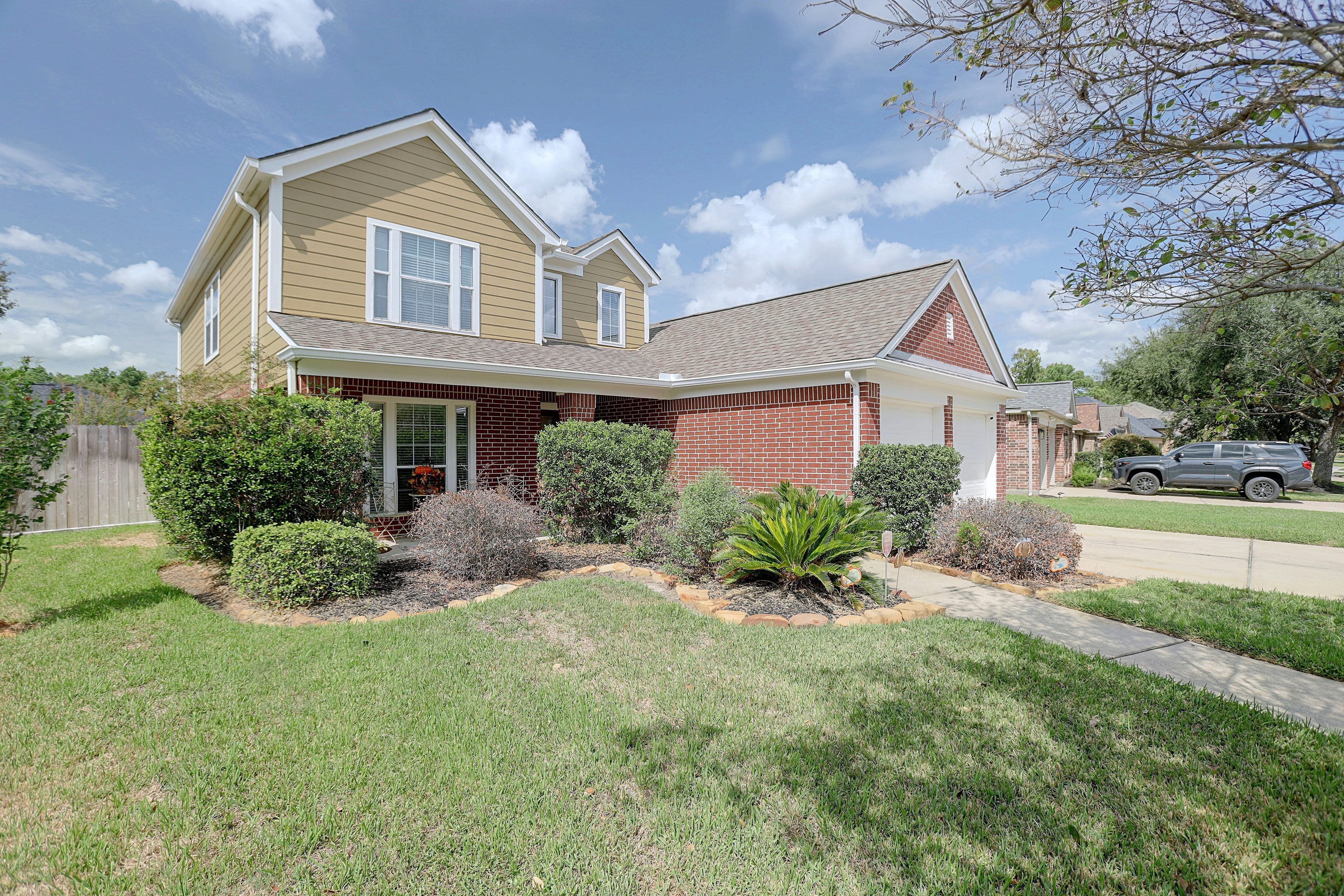 Front view of the house and front yard landscaping.