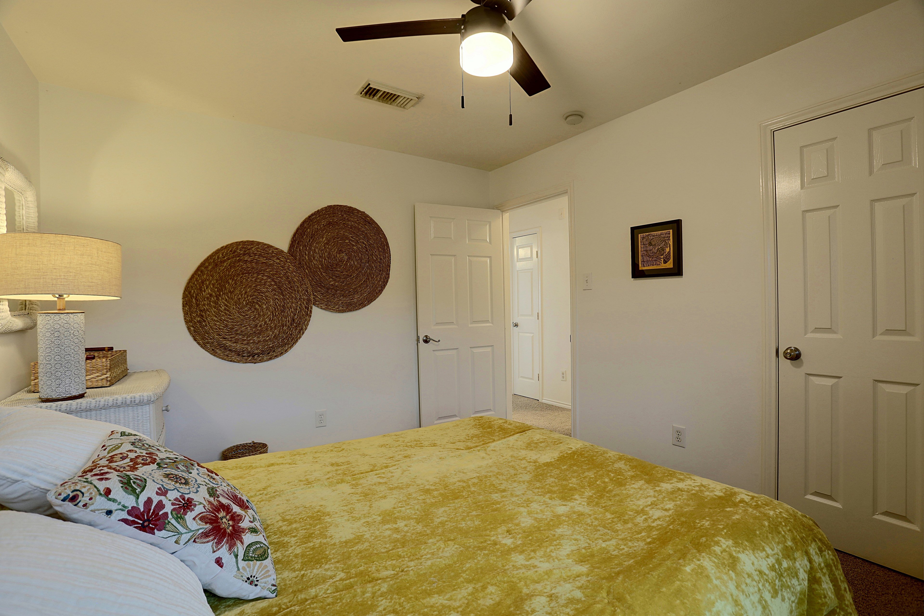 Bedroom wall view showing closet and open door.